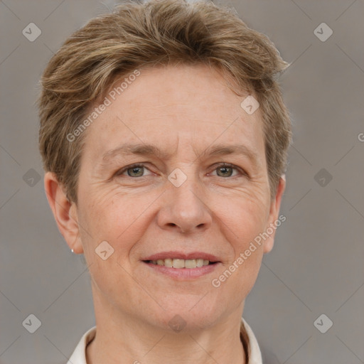 Joyful white adult female with short  brown hair and grey eyes