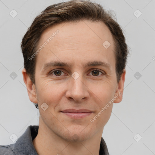 Joyful white adult male with short  brown hair and grey eyes