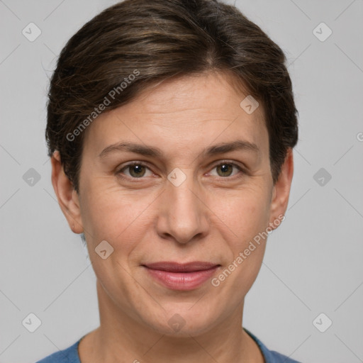 Joyful white adult female with short  brown hair and grey eyes