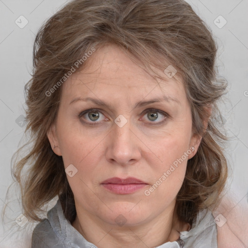 Joyful white adult female with medium  brown hair and grey eyes