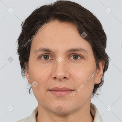 Joyful white adult female with medium  brown hair and brown eyes