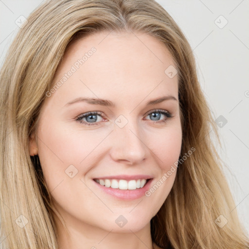 Joyful white young-adult female with long  brown hair and blue eyes