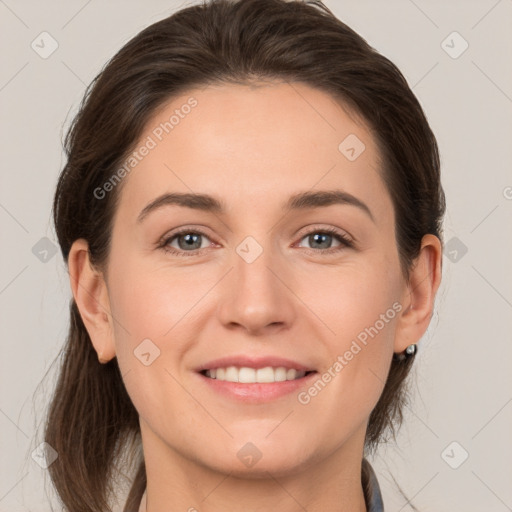 Joyful white young-adult female with medium  brown hair and grey eyes