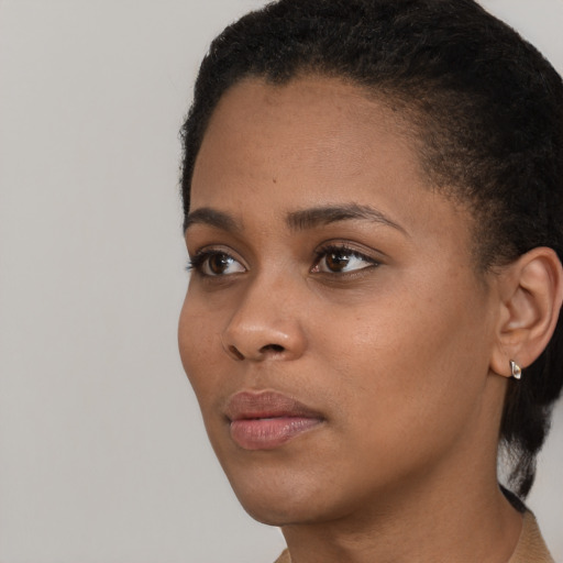 Neutral black young-adult female with short  black hair and brown eyes