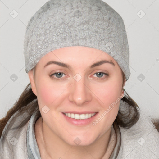 Joyful white young-adult female with medium  brown hair and blue eyes