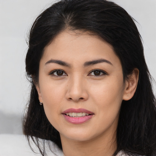 Joyful asian young-adult female with medium  black hair and brown eyes