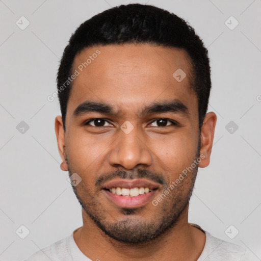 Joyful latino young-adult male with short  black hair and brown eyes