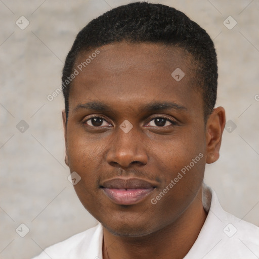 Joyful black young-adult male with short  brown hair and brown eyes