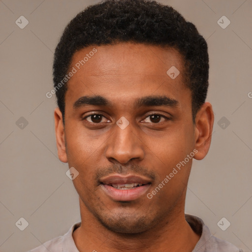 Joyful black young-adult male with short  black hair and brown eyes