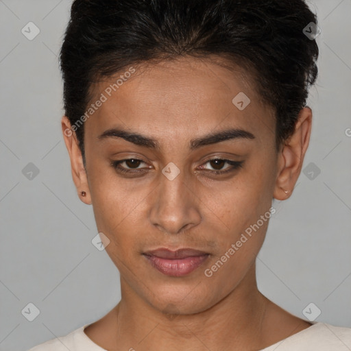 Joyful black young-adult female with short  brown hair and brown eyes