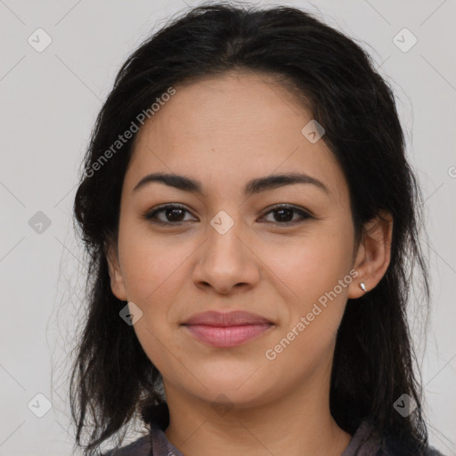 Joyful latino young-adult female with long  brown hair and brown eyes