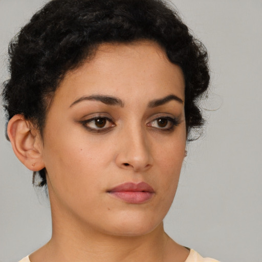 Neutral latino young-adult female with short  brown hair and brown eyes