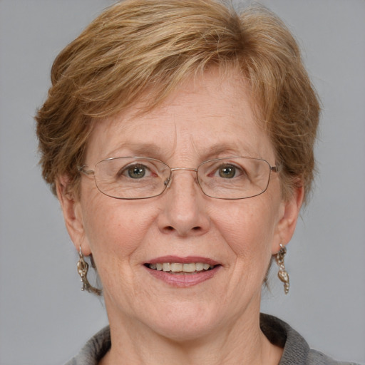 Joyful white middle-aged female with medium  brown hair and blue eyes