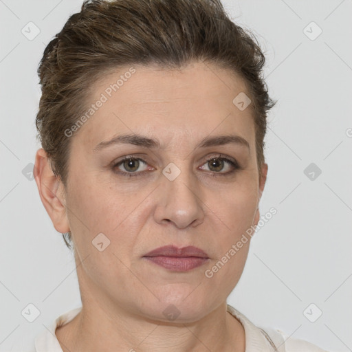 Joyful white adult female with short  brown hair and brown eyes