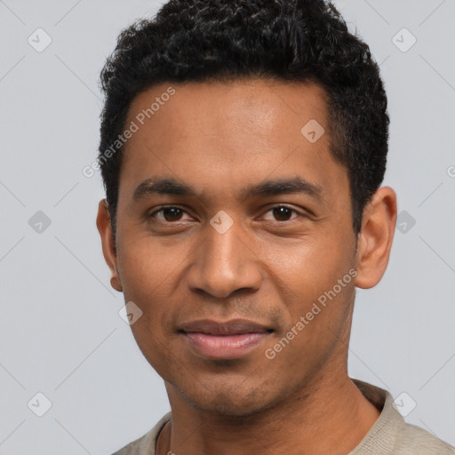 Joyful black young-adult male with short  black hair and brown eyes