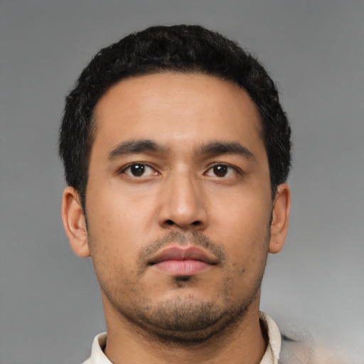 Neutral latino young-adult male with short  black hair and brown eyes