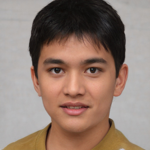 Joyful asian young-adult male with short  brown hair and brown eyes