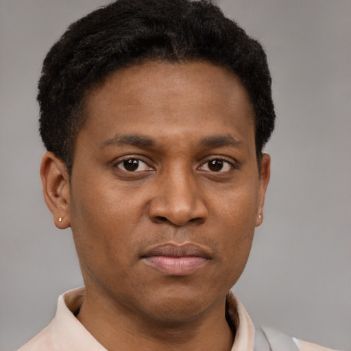 Neutral latino young-adult male with short  brown hair and brown eyes