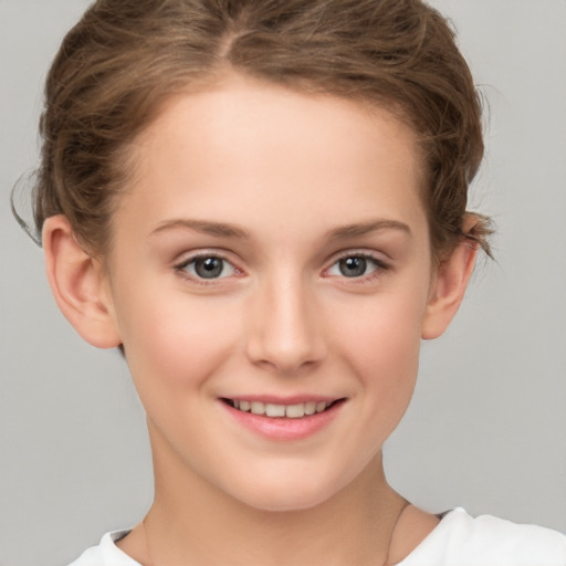 Joyful white child female with short  brown hair and brown eyes