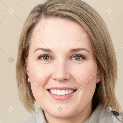 Joyful white young-adult female with medium  brown hair and green eyes