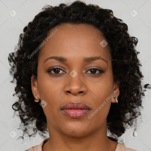 Neutral black young-adult female with medium  brown hair and brown eyes