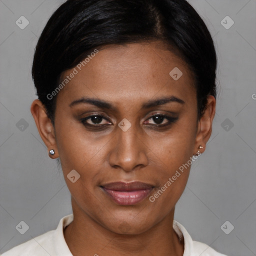 Joyful black young-adult female with short  brown hair and brown eyes