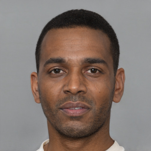 Neutral black young-adult male with short  black hair and brown eyes