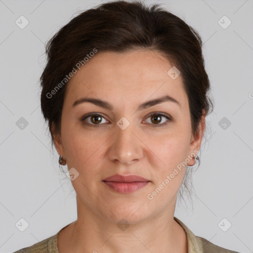 Joyful white adult female with medium  brown hair and brown eyes