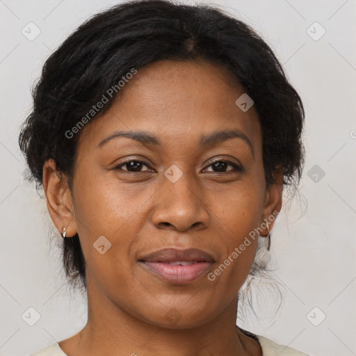 Joyful black adult female with medium  brown hair and brown eyes