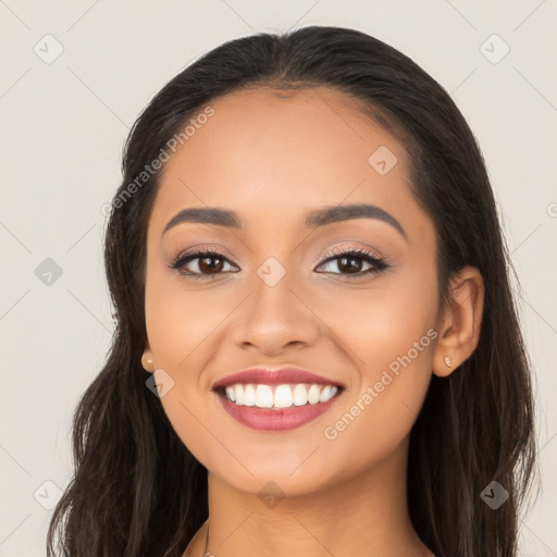 Joyful latino young-adult female with long  brown hair and brown eyes