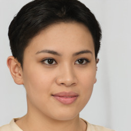 Joyful asian young-adult female with short  brown hair and brown eyes