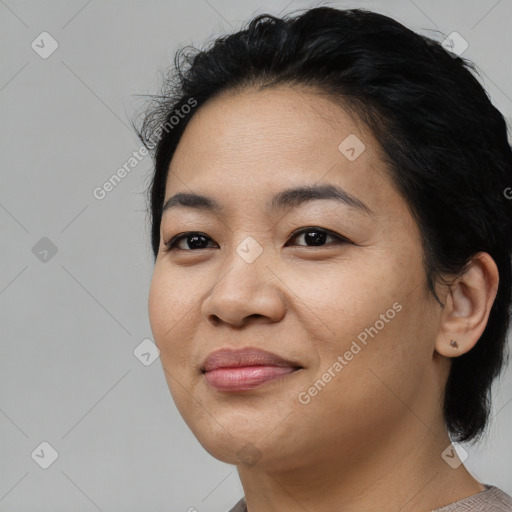 Joyful asian young-adult female with medium  black hair and brown eyes