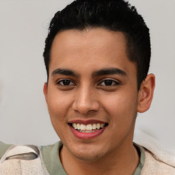 Joyful latino young-adult male with short  brown hair and brown eyes