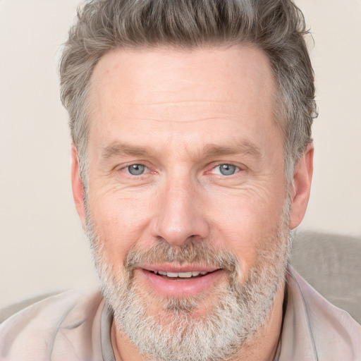 Joyful white middle-aged male with short  brown hair and grey eyes