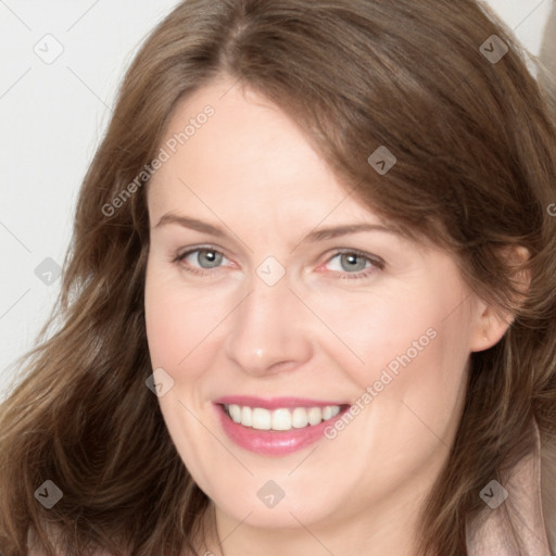 Joyful white adult female with long  brown hair and brown eyes