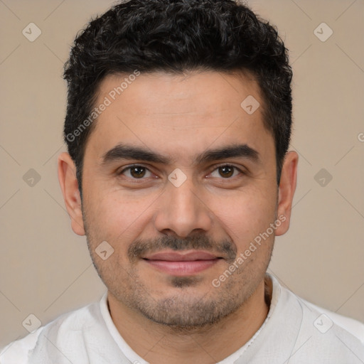 Joyful white young-adult male with short  black hair and brown eyes