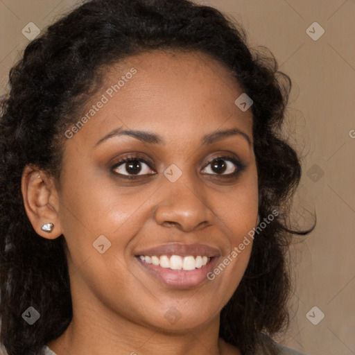 Joyful black young-adult female with long  brown hair and brown eyes