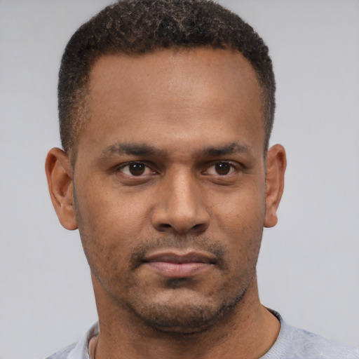 Neutral black adult male with short  brown hair and brown eyes