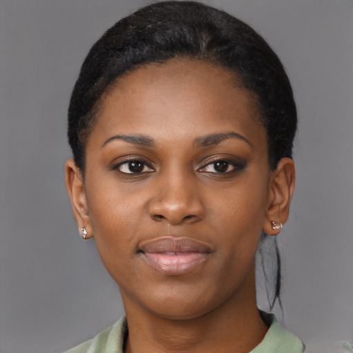 Joyful black young-adult female with medium  black hair and brown eyes