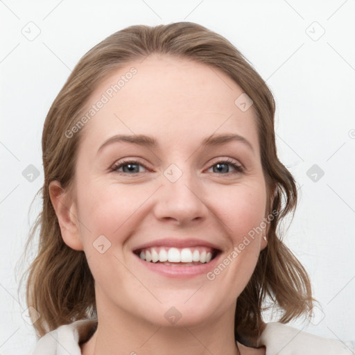 Joyful white young-adult female with medium  brown hair and blue eyes