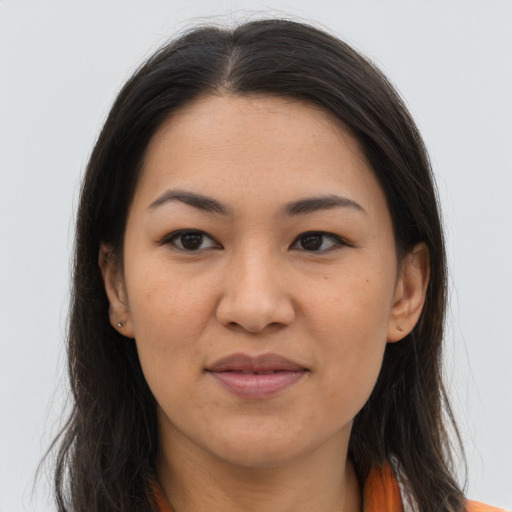 Joyful asian young-adult female with long  brown hair and brown eyes