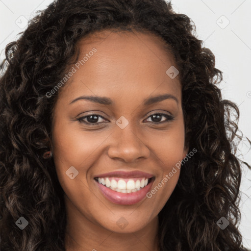 Joyful black young-adult female with long  brown hair and brown eyes