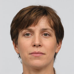 Joyful white adult female with short  brown hair and grey eyes