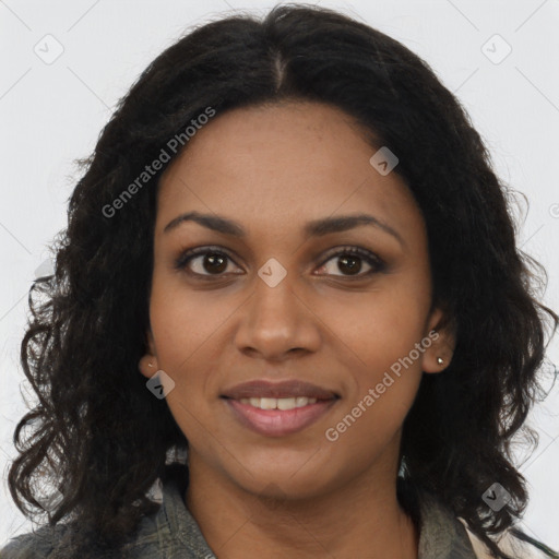 Joyful black young-adult female with long  brown hair and brown eyes