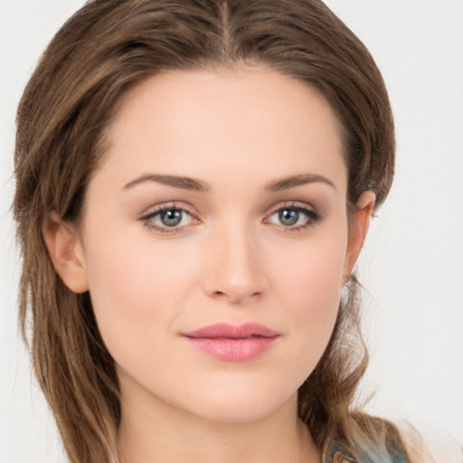 Joyful white young-adult female with long  brown hair and green eyes