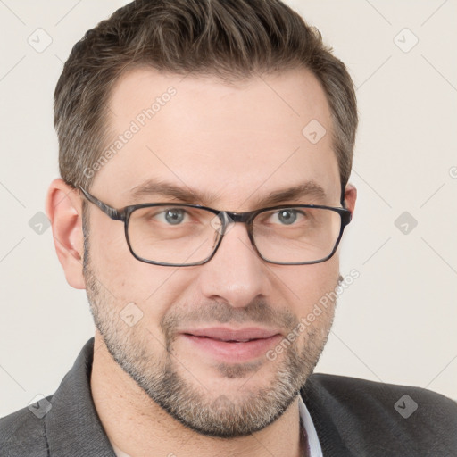 Joyful white adult male with short  brown hair and grey eyes