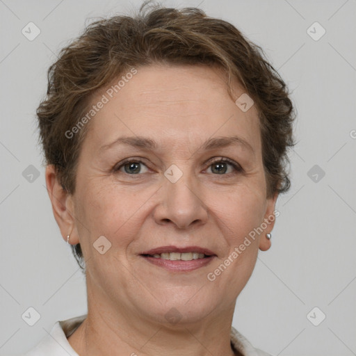 Joyful white adult female with short  brown hair and grey eyes