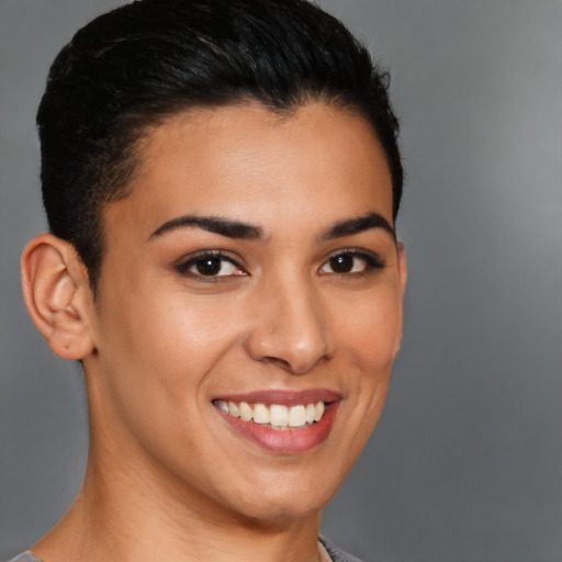 Joyful latino young-adult female with short  brown hair and brown eyes