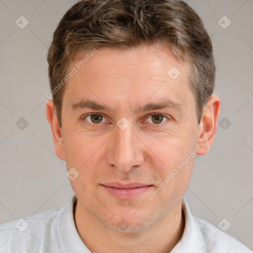 Joyful white adult male with short  brown hair and brown eyes