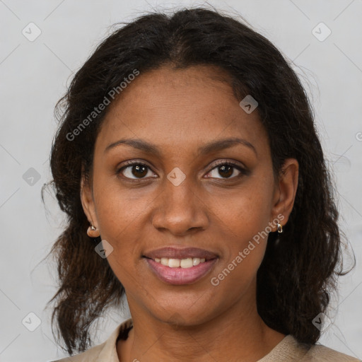 Joyful black young-adult female with medium  brown hair and brown eyes